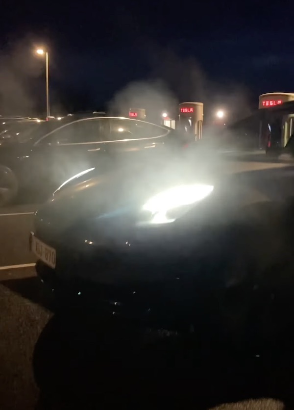 Tesla emits smoke while using supercharger